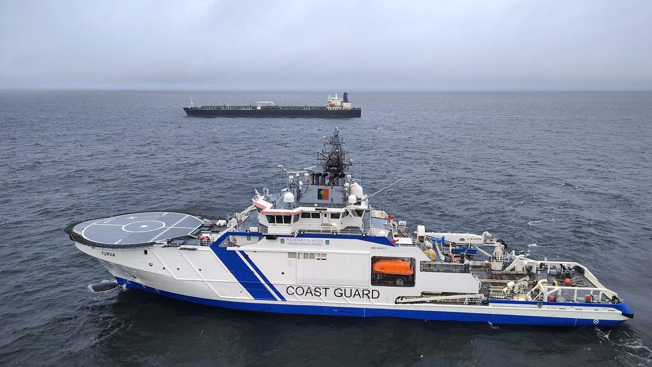 A Finnish Border Guard's ship Turva in front of the oil tanker Eagle S on the sea near Porkkalanniemi. Picture: Finnish Border Guard/AFP