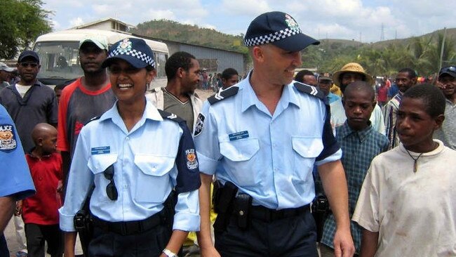 Australian Federal Police officers on patrol in PNG in 2004, before a Supreme Court ruling stripped their immunities, preventing them from working in frontline roles.