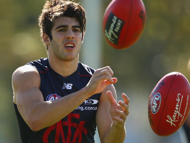 MELBOURNE, AUSTRALIA - APRIL 27: Christian Petracca of the Demons handballs during a Melbourne Demons AFL training session at Goschs Paddock on April 27, 2016 in Melbourne, Australia. (Photo by Robert Cianflone/Getty Images)