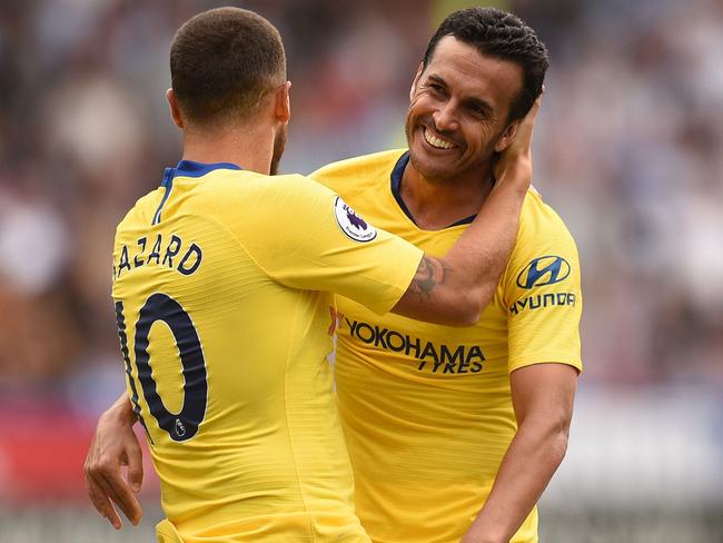 Chelsea's Spanish midfielder Pedro (R) celebrates with Chelsea's Belgian midfielder Eden Hazard after scoring the team's third goal past Huddersfield Town's English goalkeeper Ben Hamer during the English Premier League football match between Huddersfield Town and Chelsea at the John Smith's stadium in Huddersfield, northern England on August 11, 2018. (Photo by Oli SCARFF / AFP) / RESTRICTED TO EDITORIAL USE.No use with unauthorized audio, video, data, fixture lists, club/league logos or 'live' services. Online in-match use limited to 120 images. An additional 40 images may be used in extra time. No video emulation. Social media in-match use limited to 120 images. An additional 40 images may be used in extra time. No use in betting publications, games or single club/league/player publications/ /