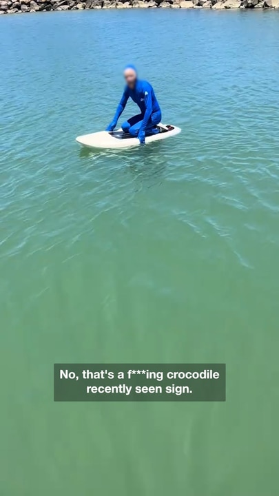 Disbelief as man paddles in crocodile infested waters despite surrounding warning signs