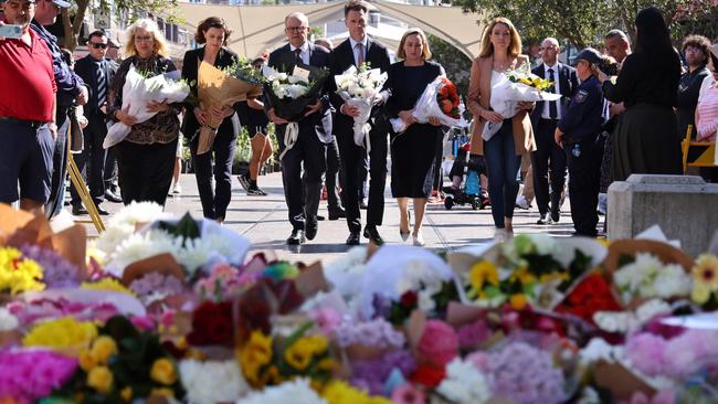 Australian Prime Minister Anthony Albanese (centre) walks with New South Wales Premier Chris Minns (centre right) and other officials as they prepare to leave flowers outside the Westfield Bondi Junction shopping mall. Picture: AFP