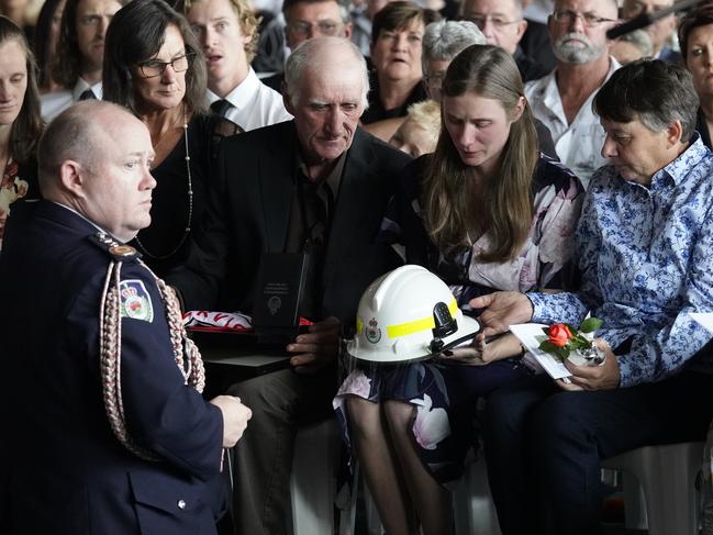 NSW Fire Commissioner Shane Fitzsimmons presenting awards to Samâ€™s widow Megan, and mum, Christine during the funeral of NSW RFS volunteer firefighter Samuel McPaul at Holbrook Sports Stadium in Albury, NSW, Friday, January 17, 2020. (AAP Image/Brad Newman) NO ARCHIVING