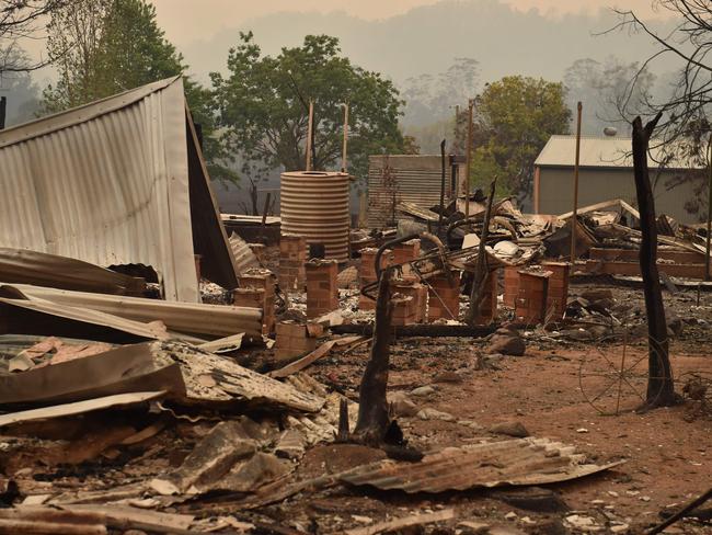 The remains of a property destroyed by fire is seen in Bobin, 350km north of Sydney. Picture: AFP