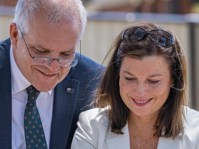 Prime Minister Scott Morrison and wife Jenny Morrison visit the school to lay flowers.As well as Gavin Pearce - Liberal member (blue shirt)His Wife & two children Mourners pay tribute to the children who died after  gust of wind swept away a jumping castle at Hillcrest Primary School Devonport Tasmania. Picture: Jason Edwards