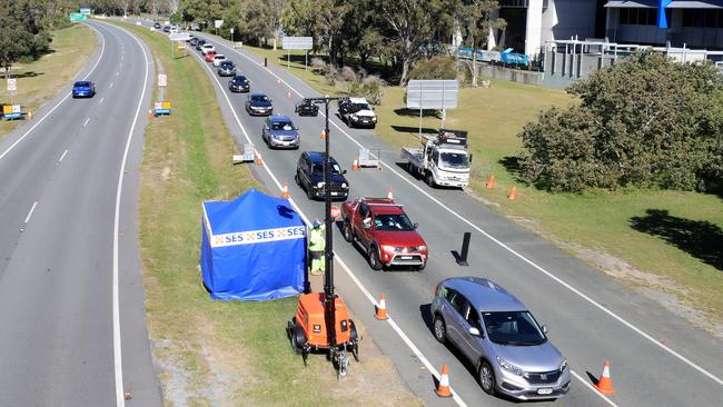 Queensland Police stop and inspect vehicles attempting to enter Queensland at Tugun outside the Gold Coast Airport border crossing. Picture: Scott Powick