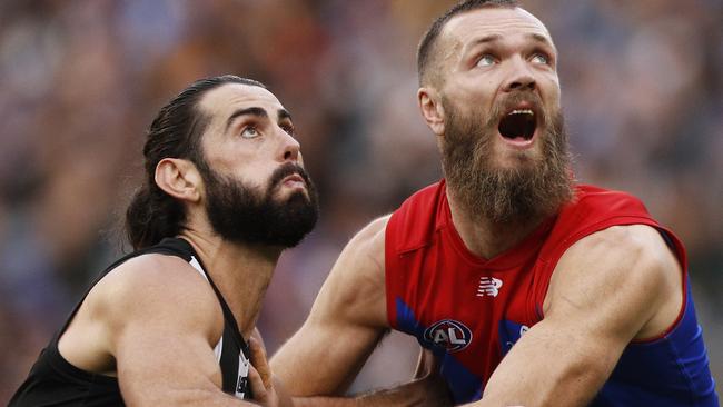 Brodie Grundy of the Magpies and Max Gawn of the Demons contest the ruck during the Round 12 AFL match between the Collingwood Magpies and the Melbourne Demons at the MCG in Melbourne, Monday, June 10, 2019. (AAP Image/Daniel Pockett) NO ARCHIVING, EDITORIAL USE ONLY