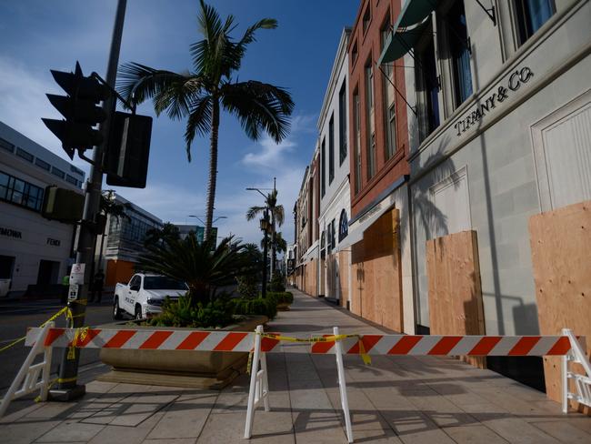 Luxury strip Rodeo Drive is closed for pedestrian and traffic, with designer stores boarded up due to fears of escalating violence. Picture: AFP