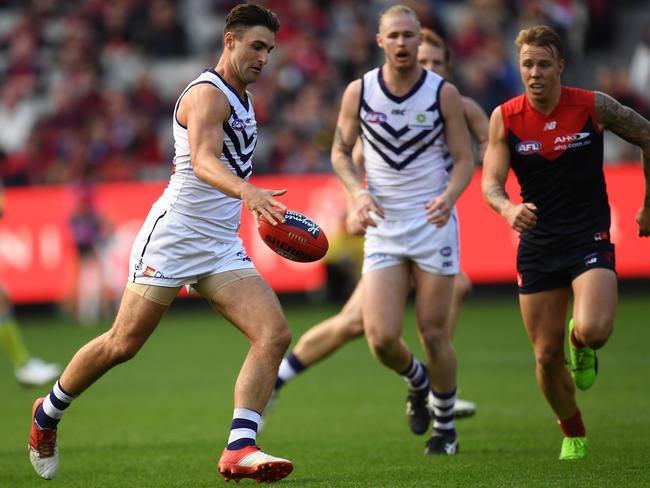 Under the pump and in the centre square, Shane Kersten gets pinged for deliberate despite kicking the ball toward his goal. Picture: AAP