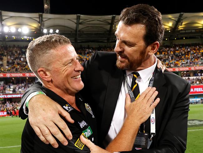 BRISBANE, AUSTRALIA - OCTOBER 24: Damien Hardwick, Senior Coach of the Tigers and CEO Brendon Gale celebrate during the 2020 Toyota AFL Grand Final match between the Richmond Tigers and the Geelong Cats at The Gabba on October 24, 2020 in Brisbane, Australia. (Photo by Michael Willson/AFL Photos via Getty Images)