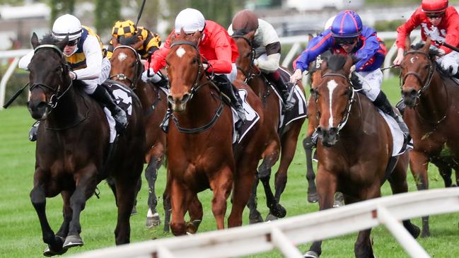 Harbour Views (white sleeves) finishing over the top of Cherry Tortoni (red) and Ayrton (blue) at Flemington when resuming. Picture: Racing Photos–George Salpigtidis