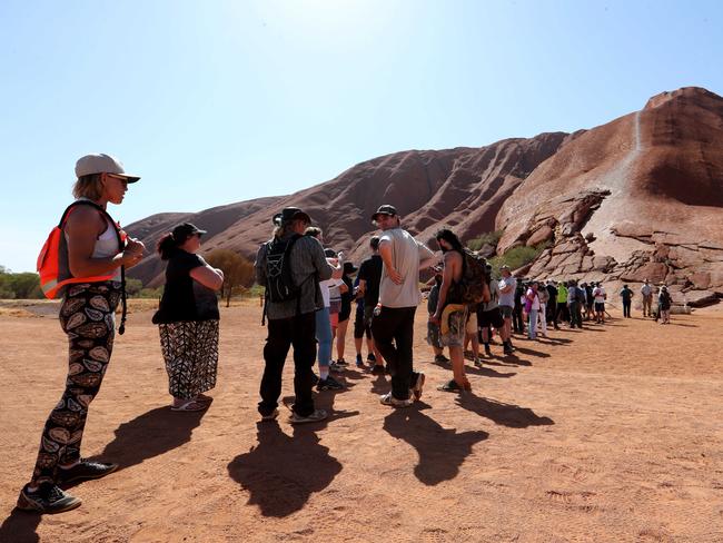 Hundreds of people head up the Uluru climb for the last time before it is banned after today. Picture: David Geraghty, The Australian.