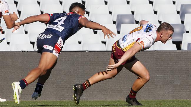 Thirlmere's Mitchell New escapes Camden’s Logan Matapuku. Picture: John Appleyard