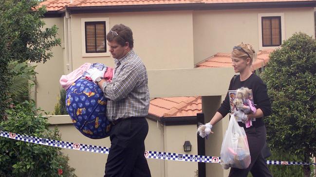 Detectives outside the Gold Coast home of Julie Rose Cowen-Nicholson and her husband Clive Anthony Nicholson.