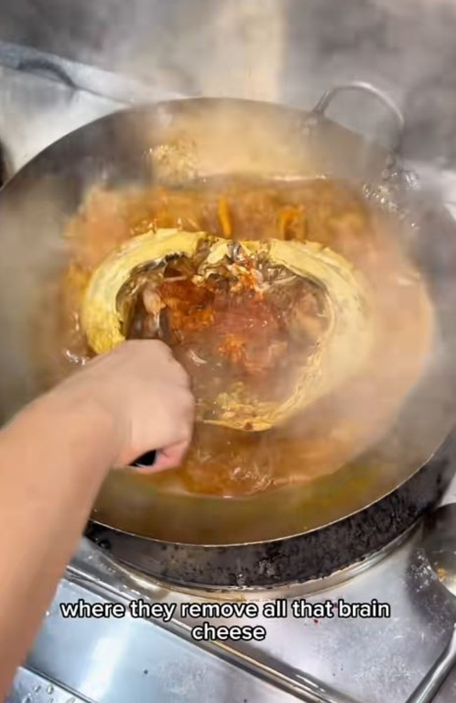 The head is then cooked in a wok and the ‘brain cheese’ removed and mixed in with the sauce, according to Mr Inskip. Picture: TikTok/EatingWithTodd