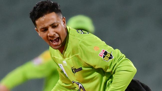 ADELAIDE, AUSTRALIA - JANUARY 22: Tanveer Sangha of the Thunder runs out Josh Philippe of the Sixers  during the Big Bash League match between the Sydney Sixers and the Sydney Thunder at Adelaide Oval, on January 22, 2021, in Adelaide, Australia. (Photo by Mark Brake/Getty Images)