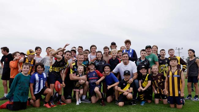 Jack Riewoldt and Matthew Richardson pops with a kids from the Community Clinic at Girdlestone Park in East Devonport. Picture: Grant Viney