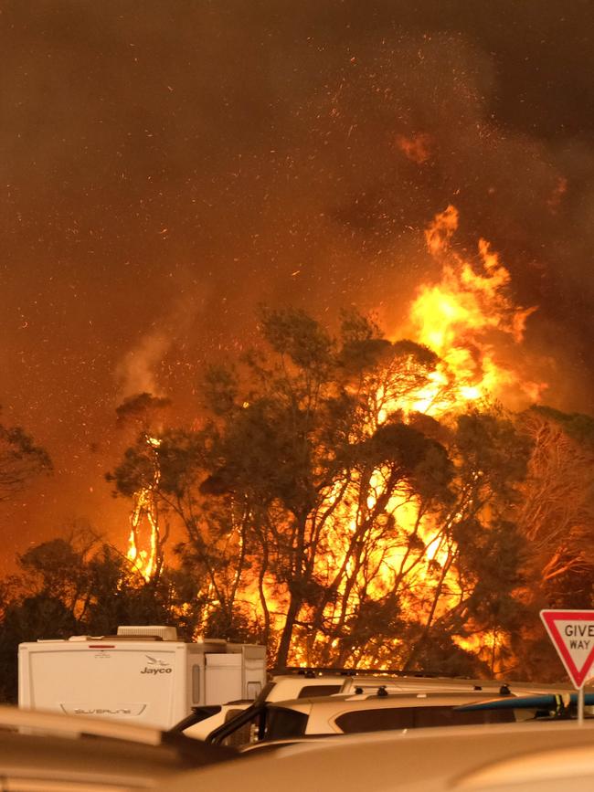 Fires burning next to the Malua Bay beach in NSW on New Year’s Eve. Picture: Alex Coppel.