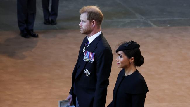 Harry and Meghan walk as procession with the coffin of Britain's Queen Elizabeth when it arrives at Westminster Hall. Picture: Getty Images