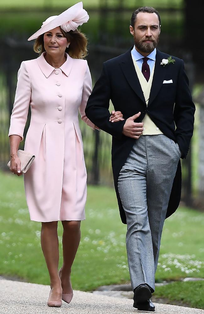 James Middleton walks with his mother Carole Middleton into the grounds.