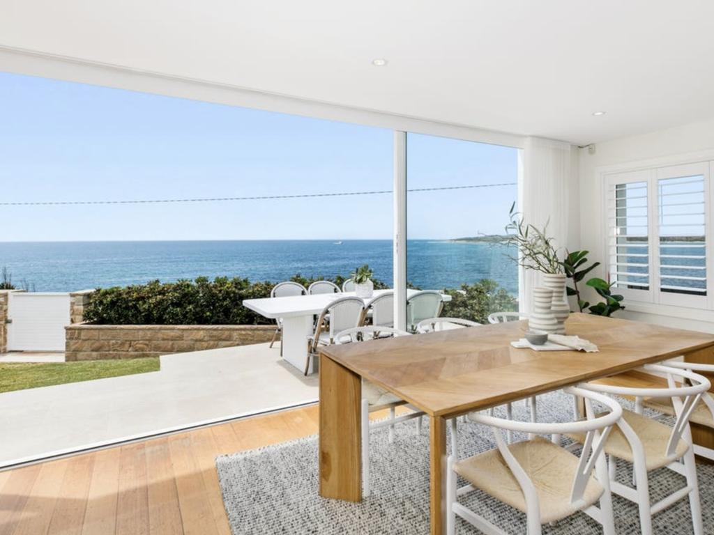 The four-bedroom, three-bathroom residence holds water views from Boat Harbour to Jibbon Beach. Picture: realestate.com.au