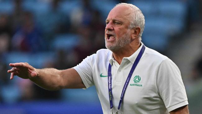 Graham Arnold stepped down as Socceroos coach last year. (Photo by HECTOR RETAMAL / AFP)