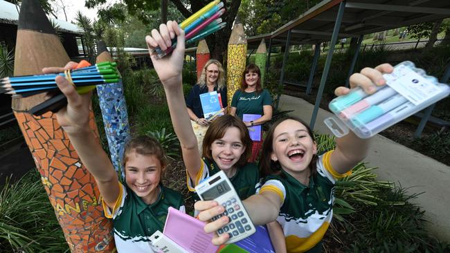 Brookfield State School students Lizzie Rieker, Hadley Taylor and Layla Stewart, with deputy principal Leah Cathcart and Stationary Aid’s Alison Schutt, with stationery for the repurposing program. Picture: Lyndon Mechielsen/The Courier-Mail