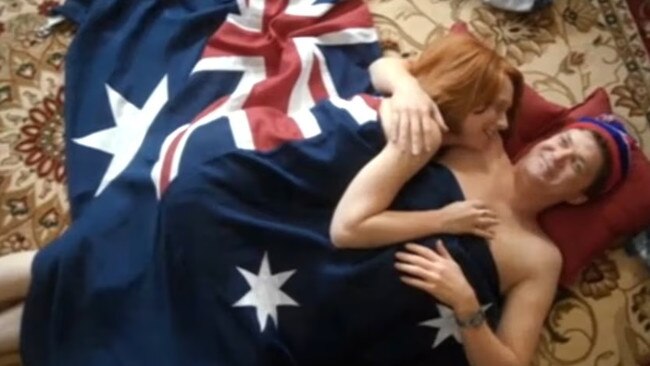 Actors playing Julia Gillard and Tim Mathieson apparently undressed under an Australian flag.