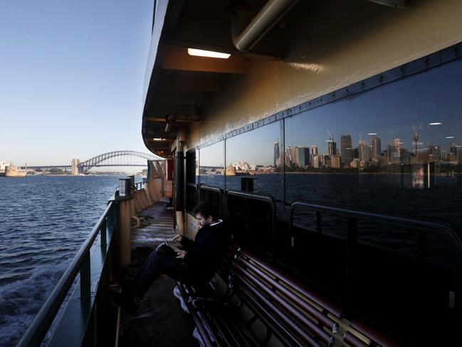 Early morning commuters travelling to the city aboard the Manly ferry, Sydney, 28 May 2020. Picture: Nikki Short