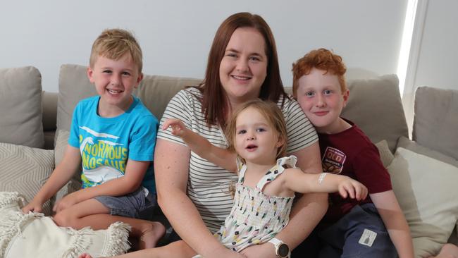 Bobby-Lee Bunney at her Ormeau home with children Liam 7, Amelia 2, and Alex 10. Childcare fees have made it hard for the mother of three to return to work full time. Picture Glenn Hampson