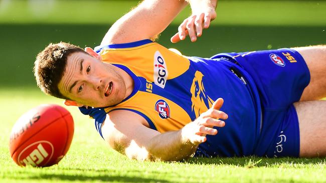 Jeremy McGovern of the Eagles reaches for the ball.