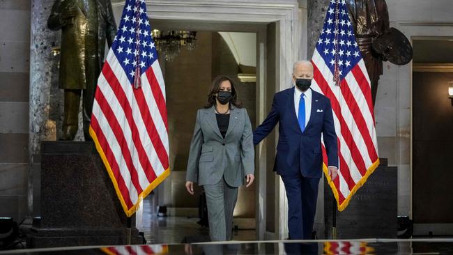 US President Joe Biden (right) and Vice President Kamala Harris arrive to speak on the anniversary of the January 6 insurrection in Statuary Hall of the US Capitol in Washington. Picture: AFP