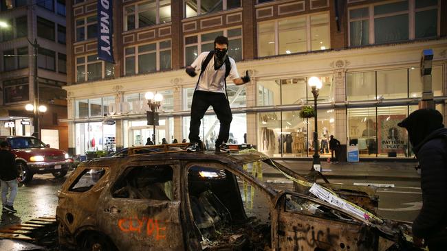 These Seattle protesters in 2020 never got the message about toning down the rhetoric. Karen Ducey/Getty Images/AFP