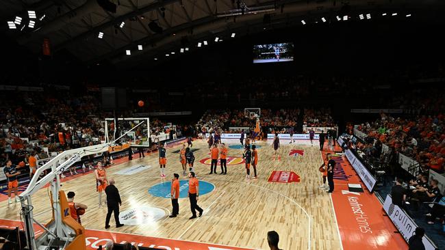 Players and officials mingle on court during the extended shot clock outage during the round 10 NBL match between Cairns Taipans and Sydney Kings at Cairns Convention Centre, on December 07, 2023. Picture: Getty Images