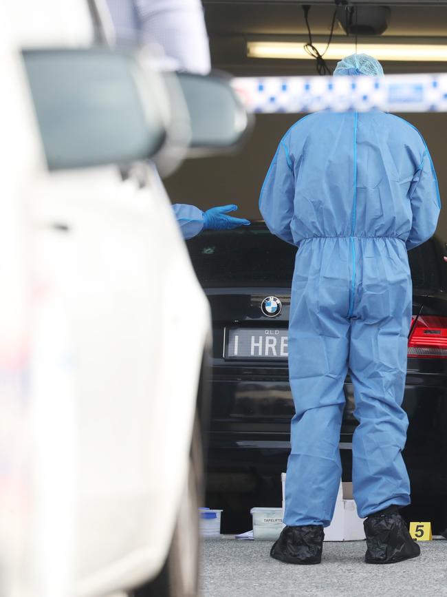 Police forensics officers at the scene. Picture: Annette Dew.