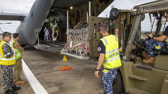 Humanitarian relief is put on an RAAF transport aircraft.