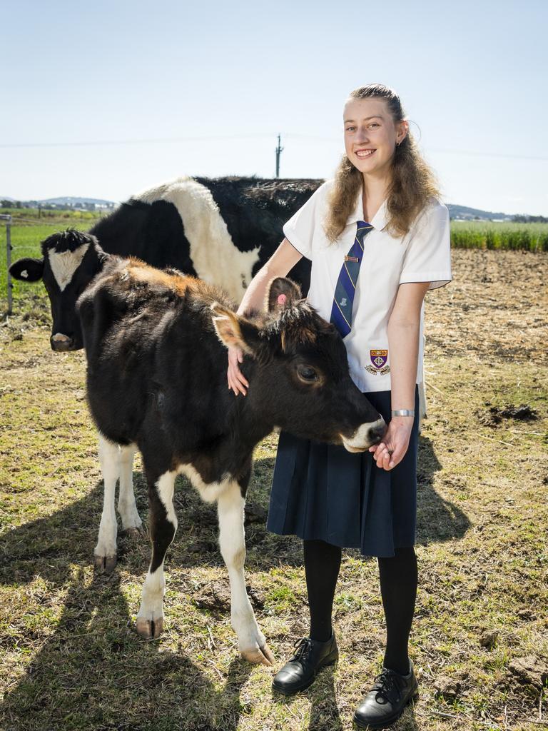 Zonta Club of Toowoomba Young Women in Public Affairs 2023 award recipient Emily Chandler at home with Winnie and Corona (back). Picture: Kevin Farmer