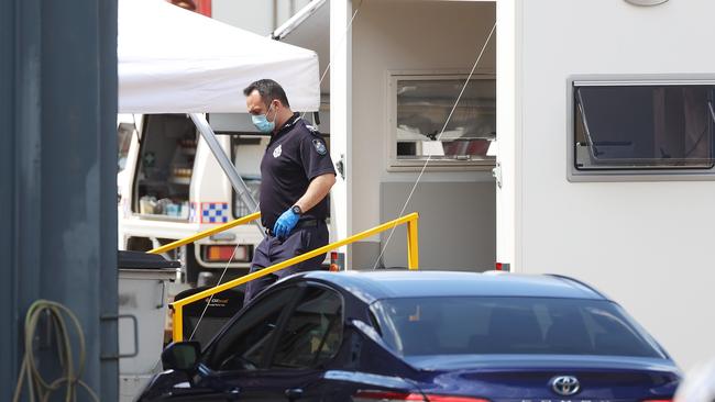 Police search an industrial shed on Musgrave Rd, Coopers Plains. Picture: Liam Kidston