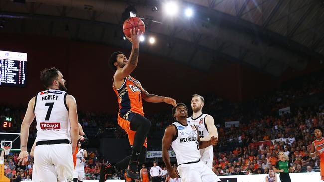 Taipans' Melo Trimble finds a way past United's Casper Ware to score in the National Basketball League (NBL) match between the Cairns Taipans and Melbourne United, held at the Cairns Convention Centre. PICTURE: BRENDAN RADKE