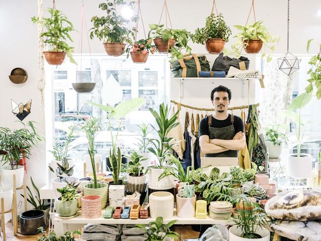 Portrait of confident small business owner in his boutique