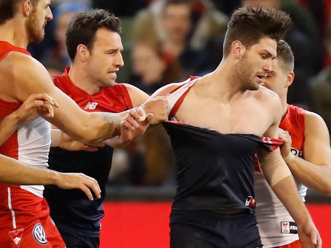 MELBOURNE, AUSTRALIA - JUNE 30: Swans players wrestle with Tomas Bugg of the Demons during the 2017 AFL round 15 match between the Melbourne Demons and the Sydney Swans at the Melbourne Cricket Ground on June 30, 2017 in Melbourne, Australia. (Photo by Michael Willson/AFL Media/Getty Images))