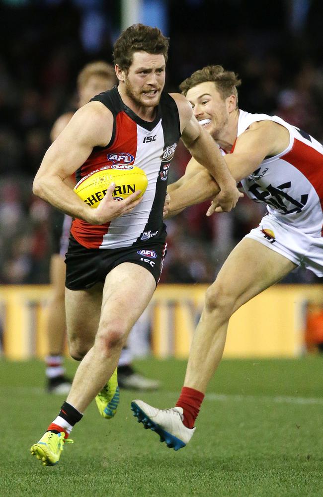 Saints midfielder Jack Steven bursts clear of Matt Jones. Picture: George Salpigtidis