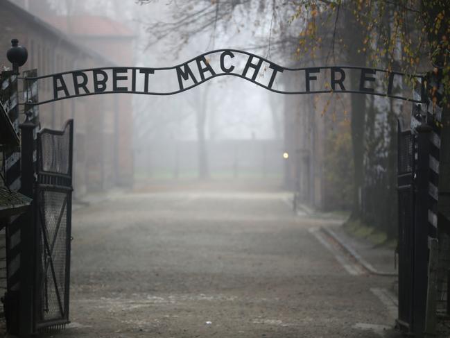 OSWIECIM, POLAND - NOVEMBER 15:   The infamous German inscription that reads 'Work Makes Free' at the main gate of the Auschwitz I extermination camp on November 15, 2014 in Oswiecim, Poland. Ceremonies marking the 70th anniversary of the liberation of the camp by Soviet soldiers are due to take place on January 27, 2015. Auschwitz was a network of concentration camps built and operated in occupied Poland by Nazi Germany during the Second World War. Auschwitz I and nearby Auschwitz II-Birkenau was the extermination camp where an estimated 1.1 million people, mostly Jews from across Europe, were killed in gas chambers or from systematic starvation, forced labour, disease and medical experiments.  (Photo by Christopher Furlong/Getty Images)