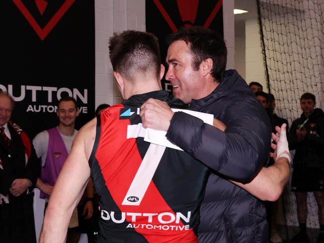 MELBOURNE, AUGUST 4, 2024: 2024 AFL Football - Round 21 - Essendon Bombers V Fremantle Dockers at the MCG. Brad Scott coach of the Bombers celebrates the win with Zach Merrett of the Bombers. Picture: Mark Stewart