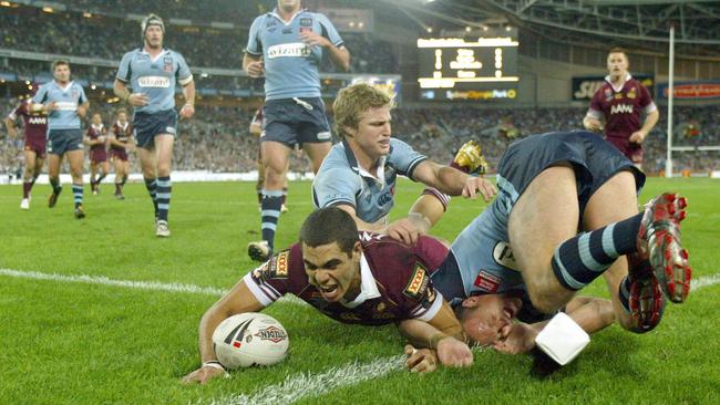 Greg Inglis scores a try in his first State of Origin game for Queensland.