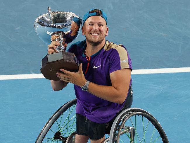 Dylan Alcott with the Australian Open trophy, his seventh. Picture: Michael Klein