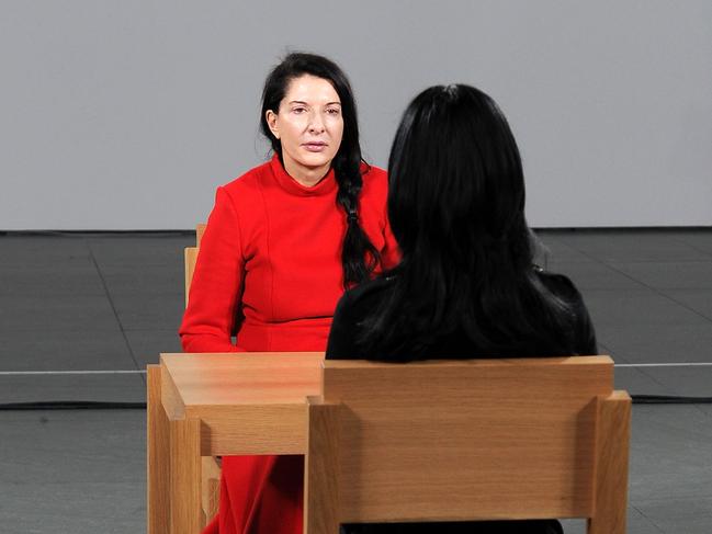 Some visitors ran to get in line to sit opposite artist Marina Abramovic during her 75-day performance, <i>The Artist is Present</i>, in 2010. The MoMA epic is at the heart of Tasmanian writer Heather Rose’s prize-winning seventh novel, which had its US launch at the famous New York museum last week. Picture: Andrew H. Walker/Getty Images