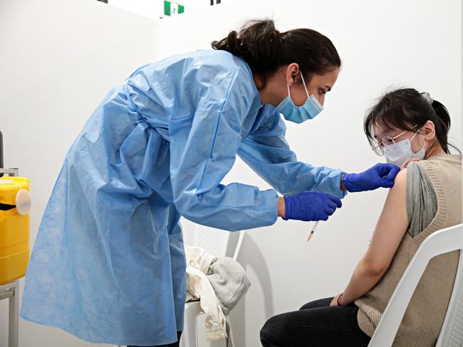 SYDNEY, AUSTRALIA- News Wire photos September 28 2021- Nan Hu, 27 (right) getting her first dose of Covid-19 vaccine at the Roseville vaccination clinic on the Pacific Hwy. Picture: NCA NewsWire / Adam Yip