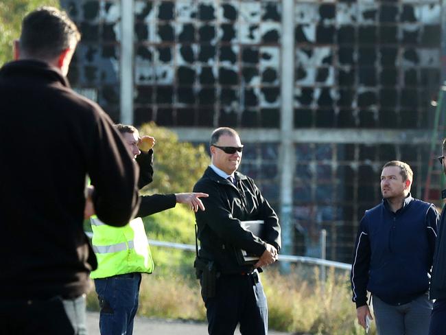 Police and City of Greater Geelong staff at the site of a building fire behind Osborne House. Picture: Alison Wynd