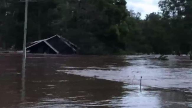 The house took trees out as it floated down the swollen river. Source: ABC News